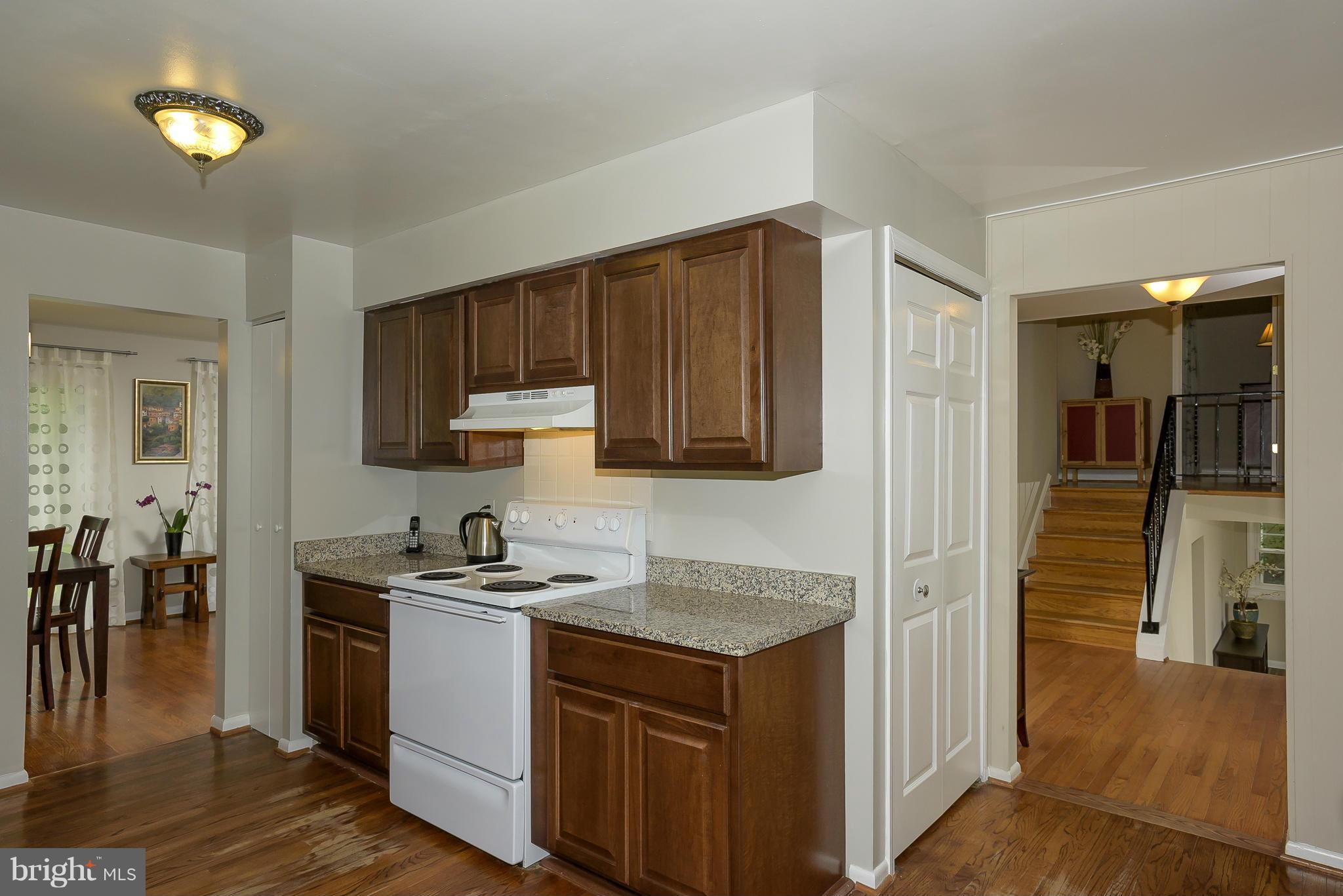 13007 Broadmore Road Silver Spring, MD 20904 - Photo 6 of 30 a kitchen with a sink cabinets and wooden floor