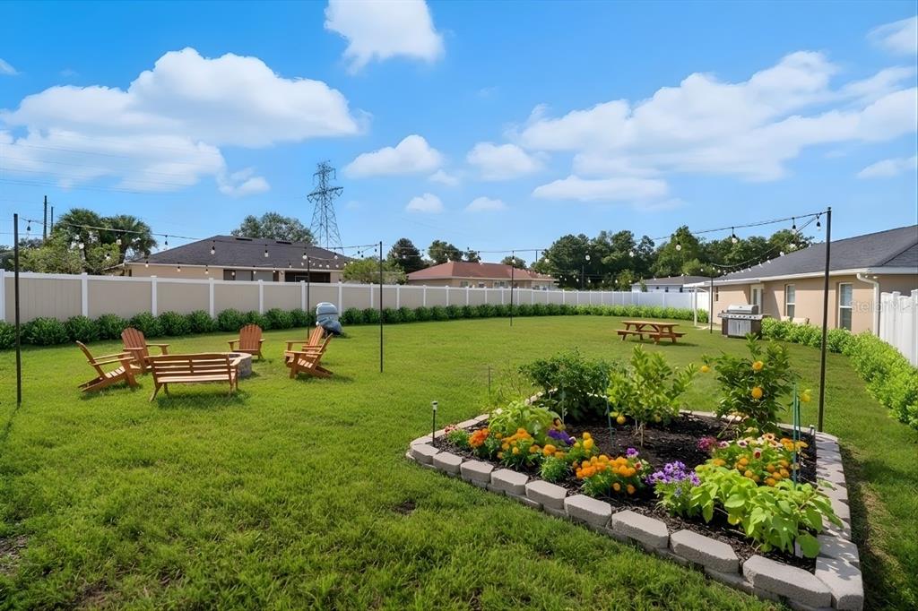 1 Pecan Course Circle Ocala, FL 34472 - Photo 13 of 24 a view of a lake with a garden and a bench
