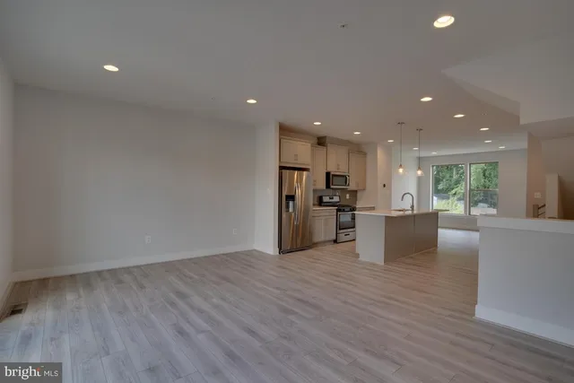 a view of kitchen and wooden floor