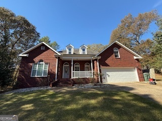 322 Pheasant Ridge Drive Warner Robins, GA 31088 - Photo 1 of 19 a front view of a house with a yard and garage