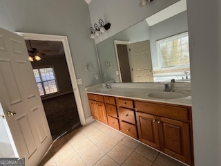 322 Pheasant Ridge Drive Warner Robins, GA 31088 - Photo 12 of 19 a bathroom with a sink a vanity and a mirror