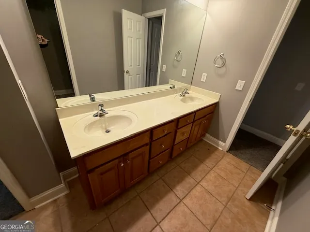 a bathroom with a double vanity sink a and mirror