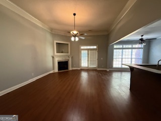 322 Pheasant Ridge Drive Warner Robins, GA 31088 - Photo 4 of 19 an empty room with wooden floor and windows