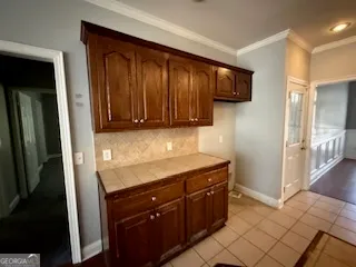 a kitchen with a sink and cabinets