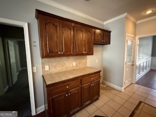 322 Pheasant Ridge Drive Warner Robins, GA 31088 - Photo 7 of 19 a kitchen with a sink and cabinets