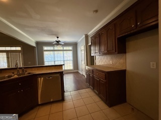 322 Pheasant Ridge Drive Warner Robins, GA 31088 - Photo 8 of 19 a kitchen with stainless steel appliances granite countertop a stove a sink and a microwave