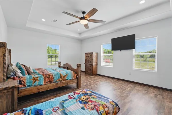 a bedroom with bed and a window