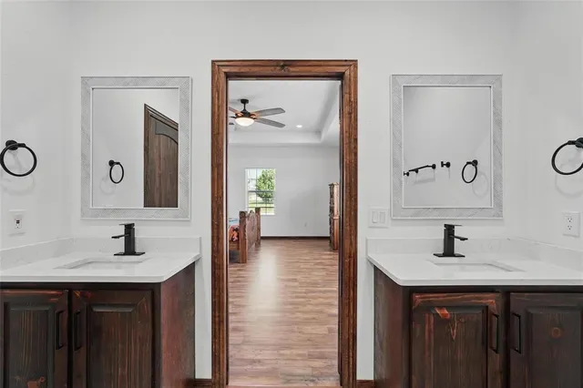 a en suite bathroom with a sink and a mirror