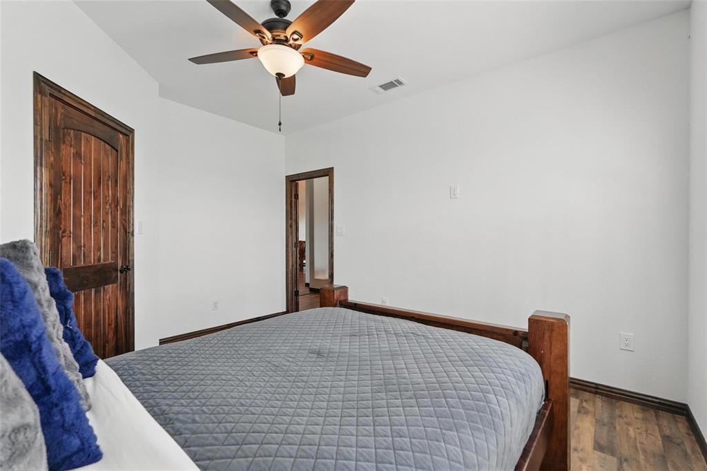4248 North Fm 273 Ivanhoe, TX 75447 - Photo 21 of 33 a view of a livingroom with a ceiling fan and wooden floor