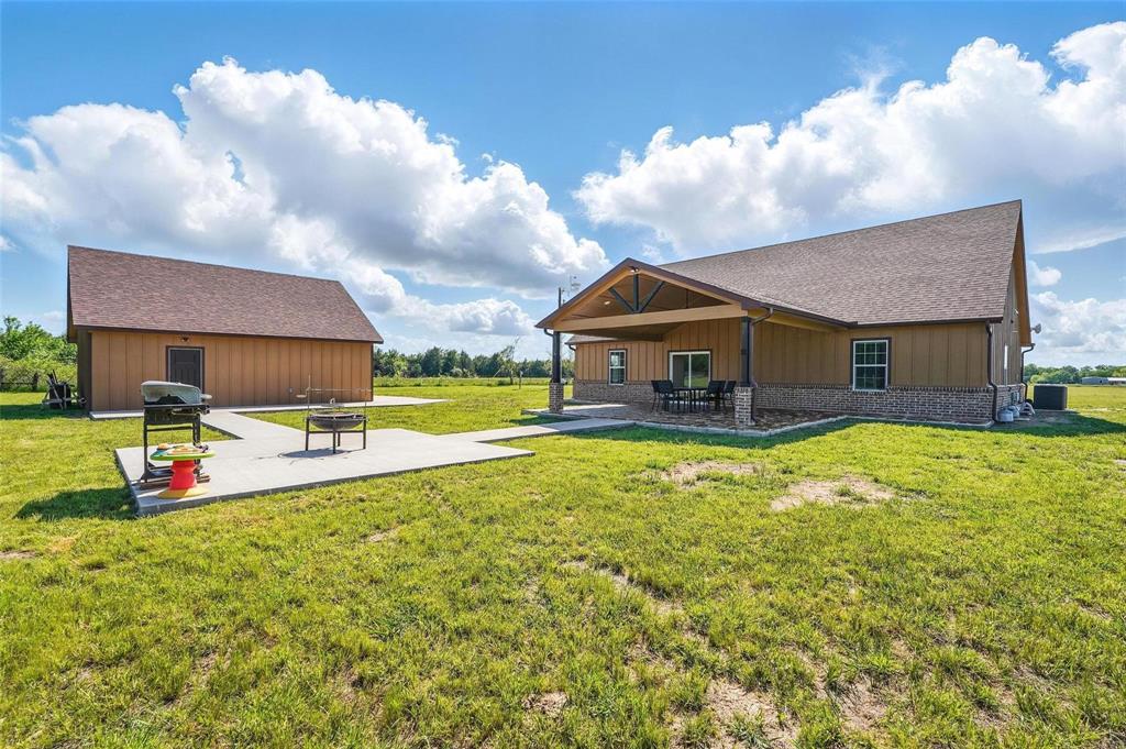 4248 North Fm 273 Ivanhoe, TX 75447 - Photo 30 of 33 a view of a house with pool and a yard