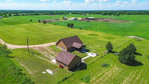 a view of a garden with an outdoor space