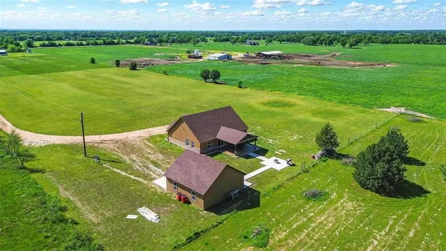 a view of a garden with an outdoor space