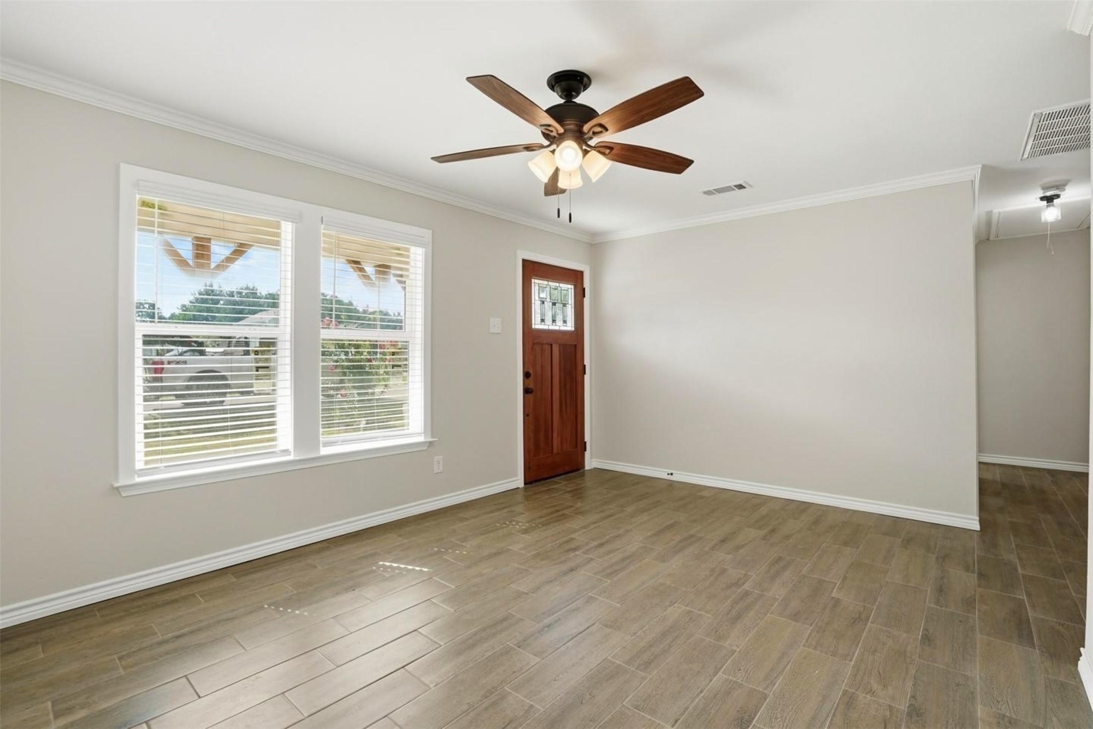 6518 Paris Street Houston, TX 77021 - Photo 4 of 23 wooden floor in an empty room with a window