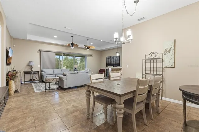 a kitchen with stainless steel appliances granite countertop a sink counter space cabinets and a large window