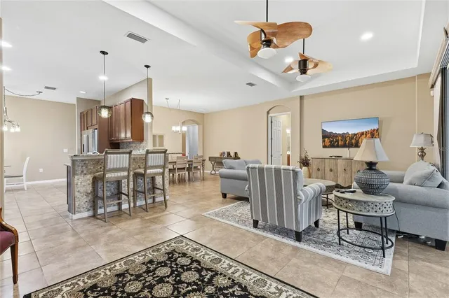 a bathroom with a granite countertop sink a toilet and mirror