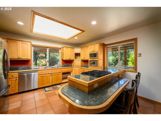 a kitchen with a sink appliances and a counter top space