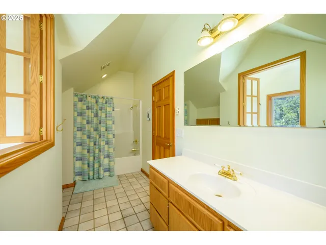 a bathroom with a sink a bathtub and a shower