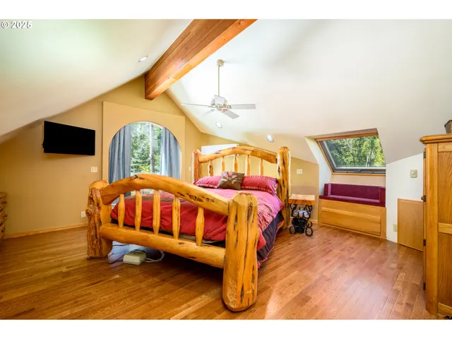 a bedroom with a bed and a night stand