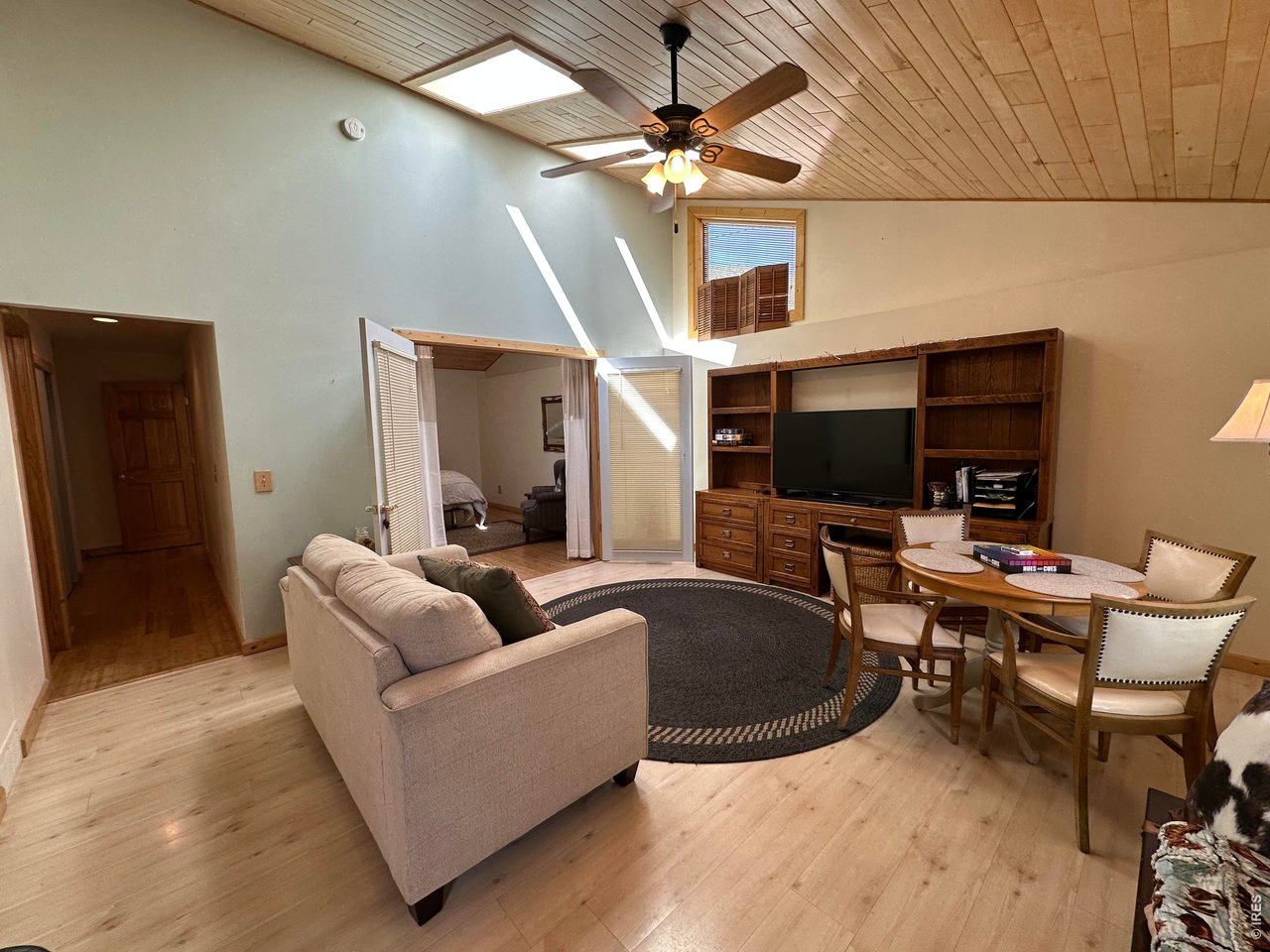 123 Mohawk Road Lyons, CO 80540 - Photo 21 of 35 a living room with furniture and a flat screen tv