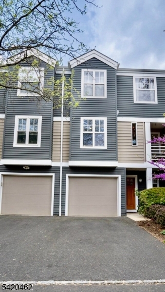 a front view of a house with a garage