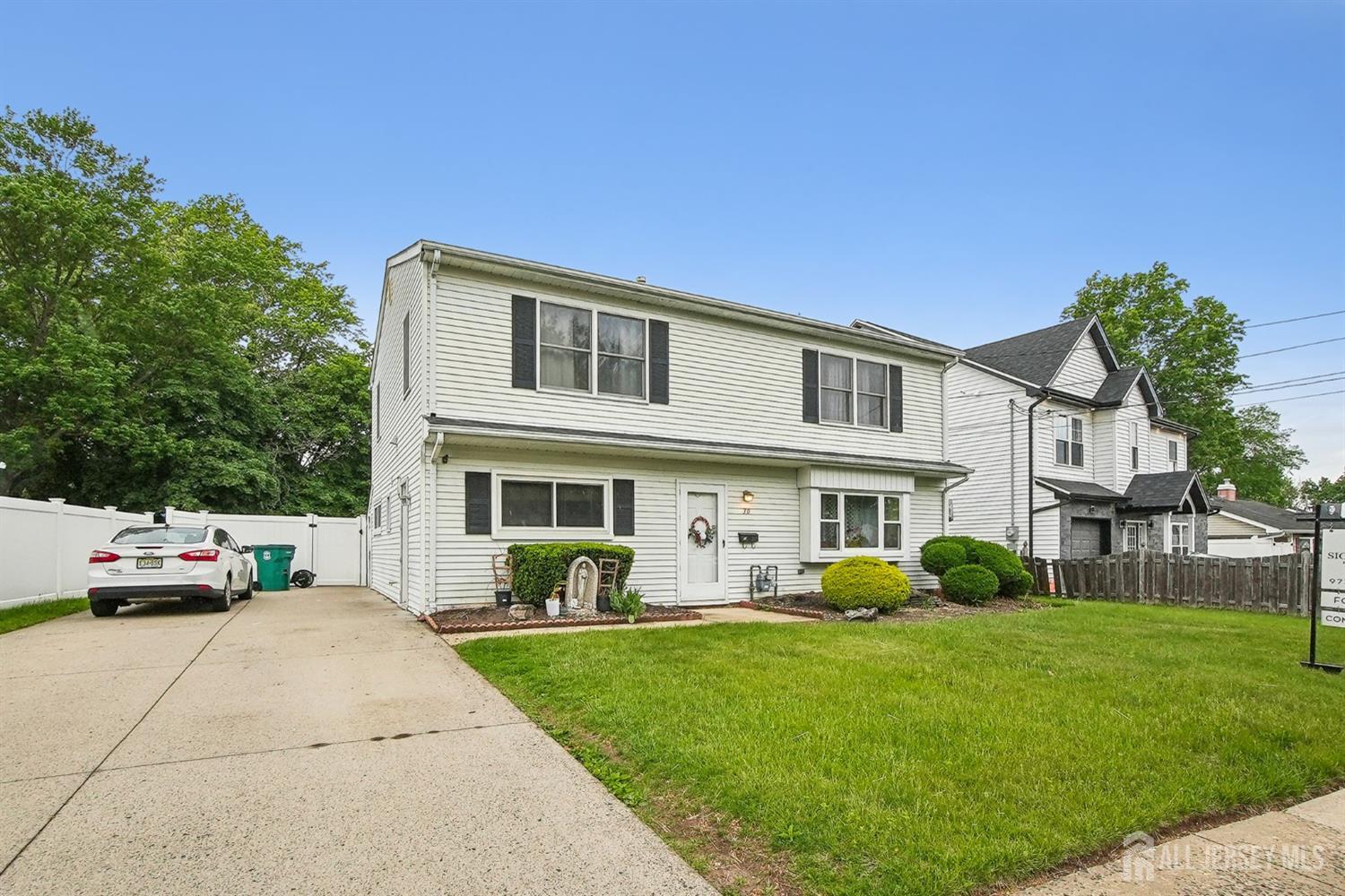 30 Kenmore Road Edison, NJ 08817 - Photo 1 of 25 a front view of a house with a garden