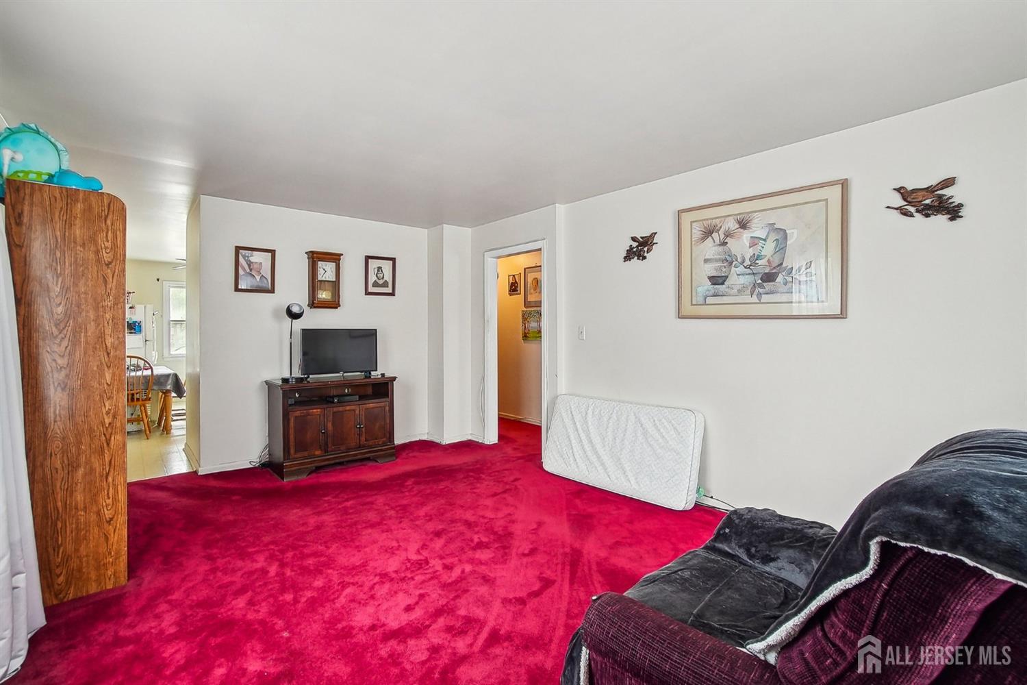 30 Kenmore Road Edison, NJ 08817 - Photo 14 of 25 a bedroom with a bed and a flat screen tv
