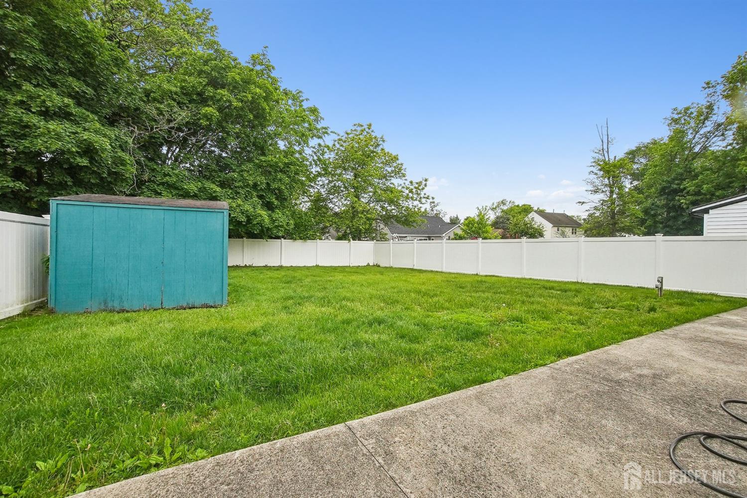 30 Kenmore Road Edison, NJ 08817 - Photo 24 of 25 a view of a backyard with green space
