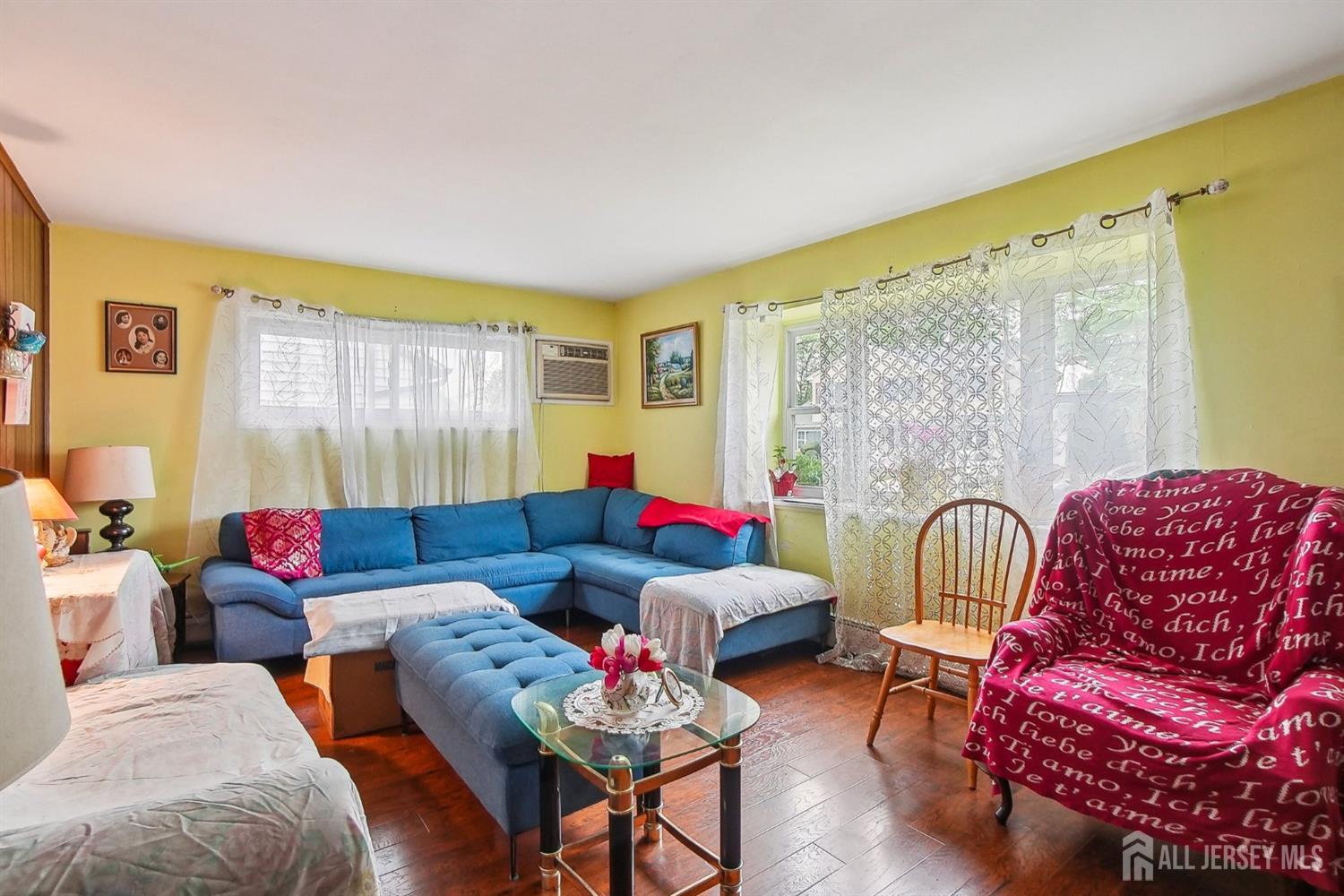 30 Kenmore Road Edison, NJ 08817 - Photo 8 of 25 a living room with furniture and a large window