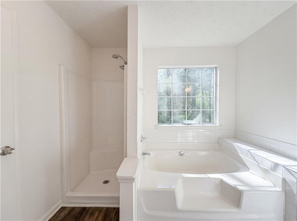 3546 Broad Oak Court Decatur, GA 30034 - Photo 11 of 33 a bath tub sitting in a bathroom next to a window
