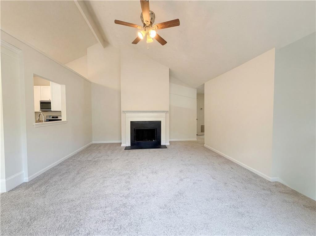 3546 Broad Oak Court Decatur, GA 30034 - Photo 18 of 33 an empty room with fireplace and fan