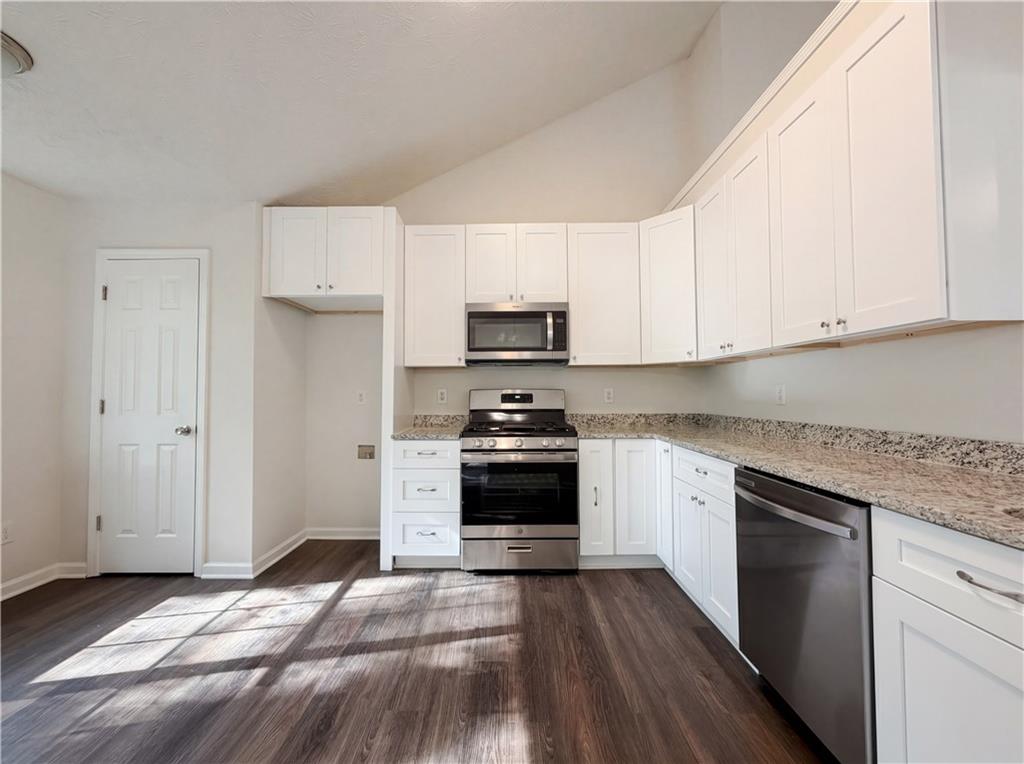 3546 Broad Oak Court Decatur, GA 30034 - Photo 2 of 33 a kitchen with granite countertop white cabinets and stainless steel appliances