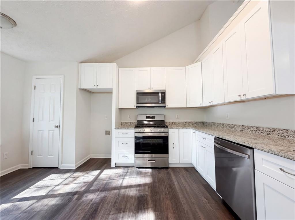 3546 Broad Oak Court Decatur, GA 30034 - Photo 21 of 33 a kitchen with granite countertop white cabinets and stainless steel appliances