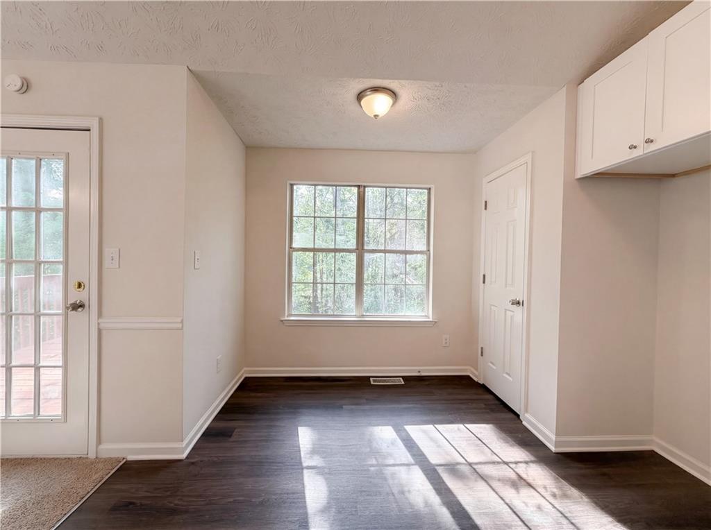 3546 Broad Oak Court Decatur, GA 30034 - Photo 24 of 33 an empty room with wooden floor and windows