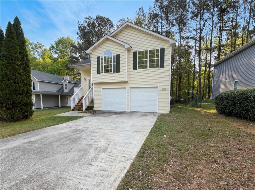 3546 Broad Oak Court Decatur, GA 30034 - Photo 7 of 33 a view of a house with a yard and garage