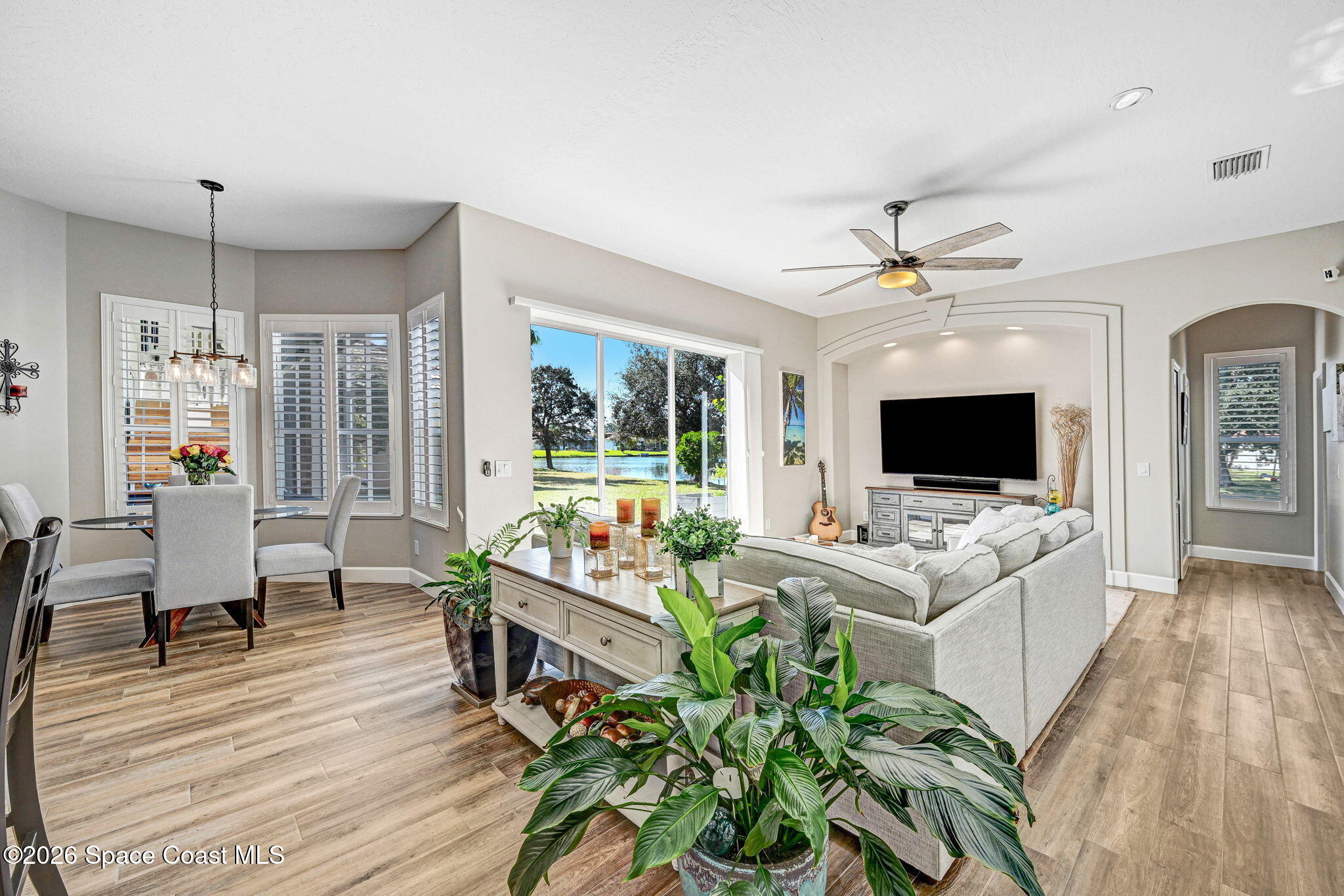 3330 Poseidon Way Indialantic, FL 32903 - Photo 13 of 47 a living room with furniture and a flat screen tv
