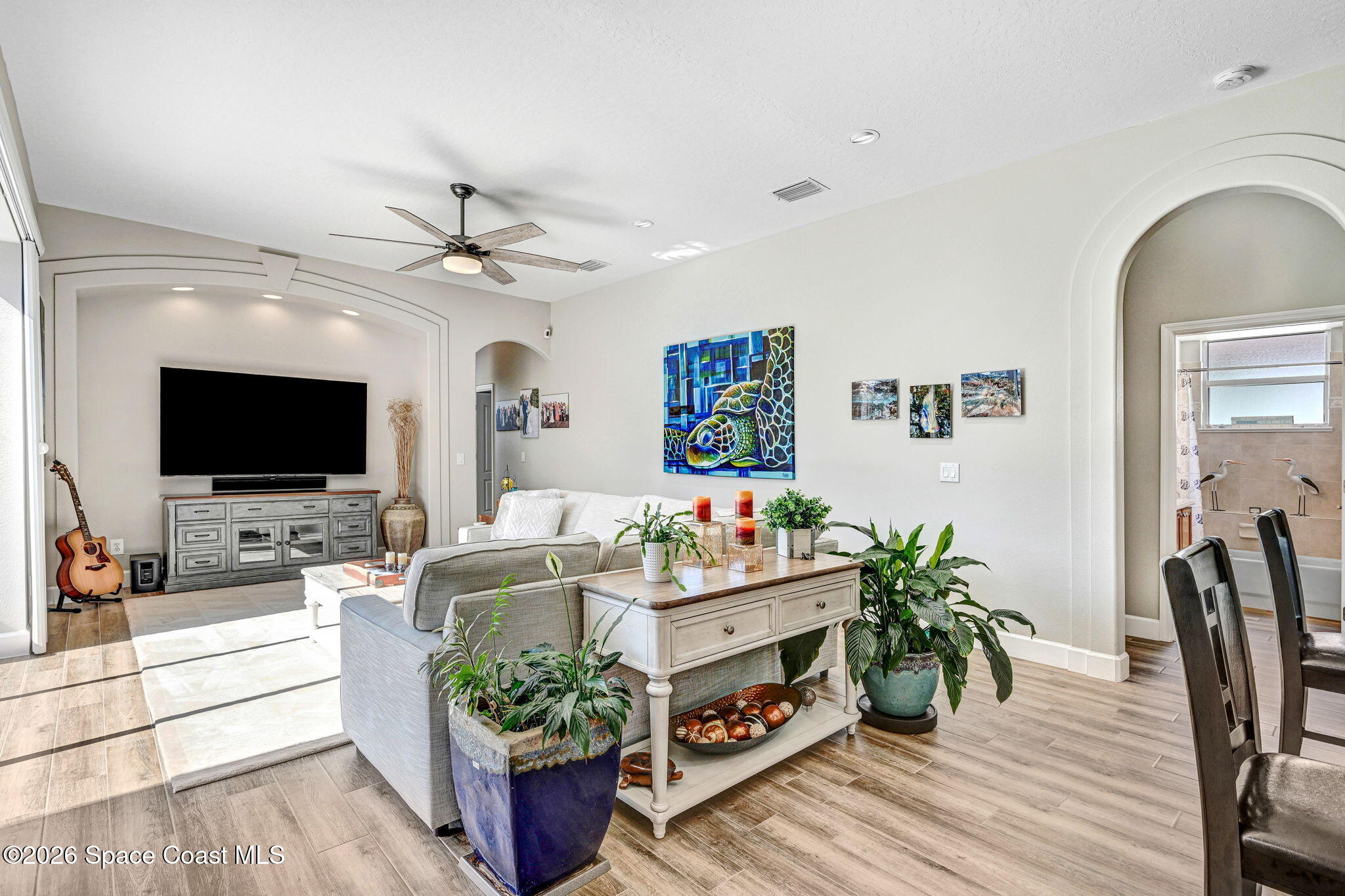 3330 Poseidon Way Indialantic, FL 32903 - Photo 14 of 47 a living room with furniture and a flat screen tv
