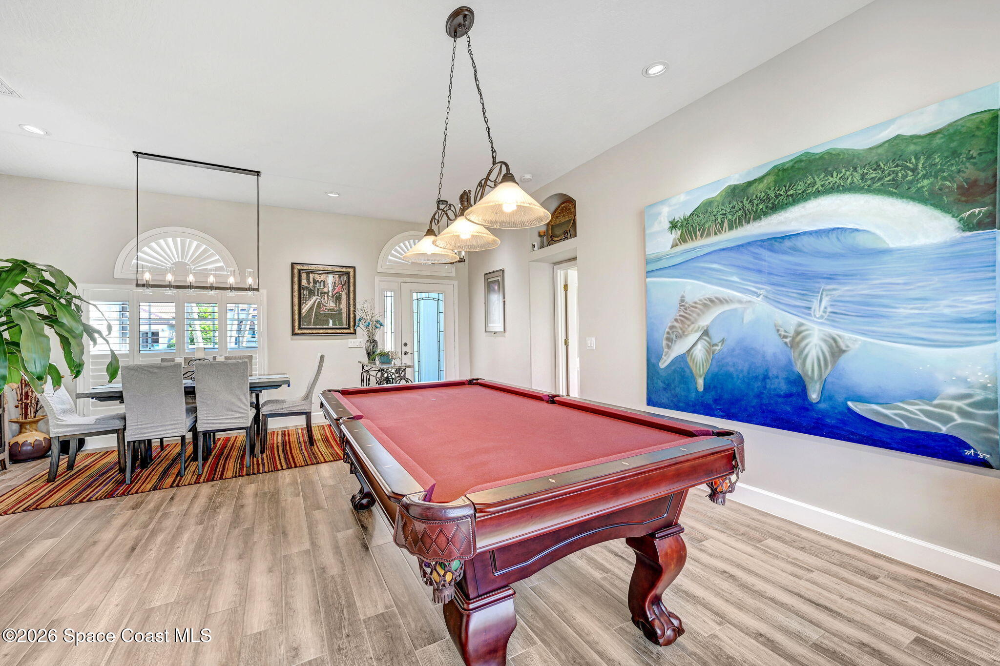 3330 Poseidon Way Indialantic, FL 32903 - Photo 18 of 47 a room with wooden floor pool table and windows