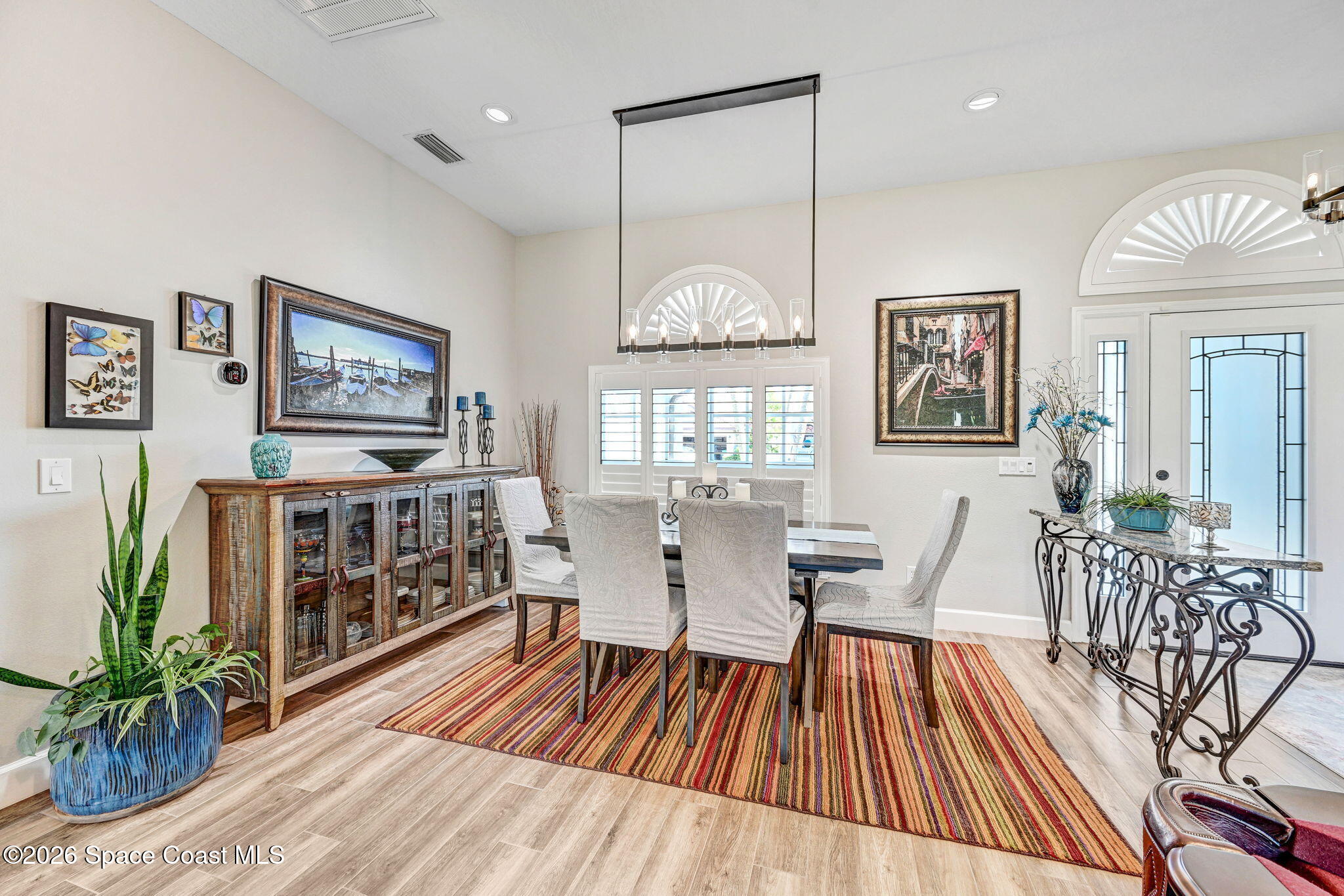 3330 Poseidon Way Indialantic, FL 32903 - Photo 19 of 47 a living room with furniture fireplace and wooden floor