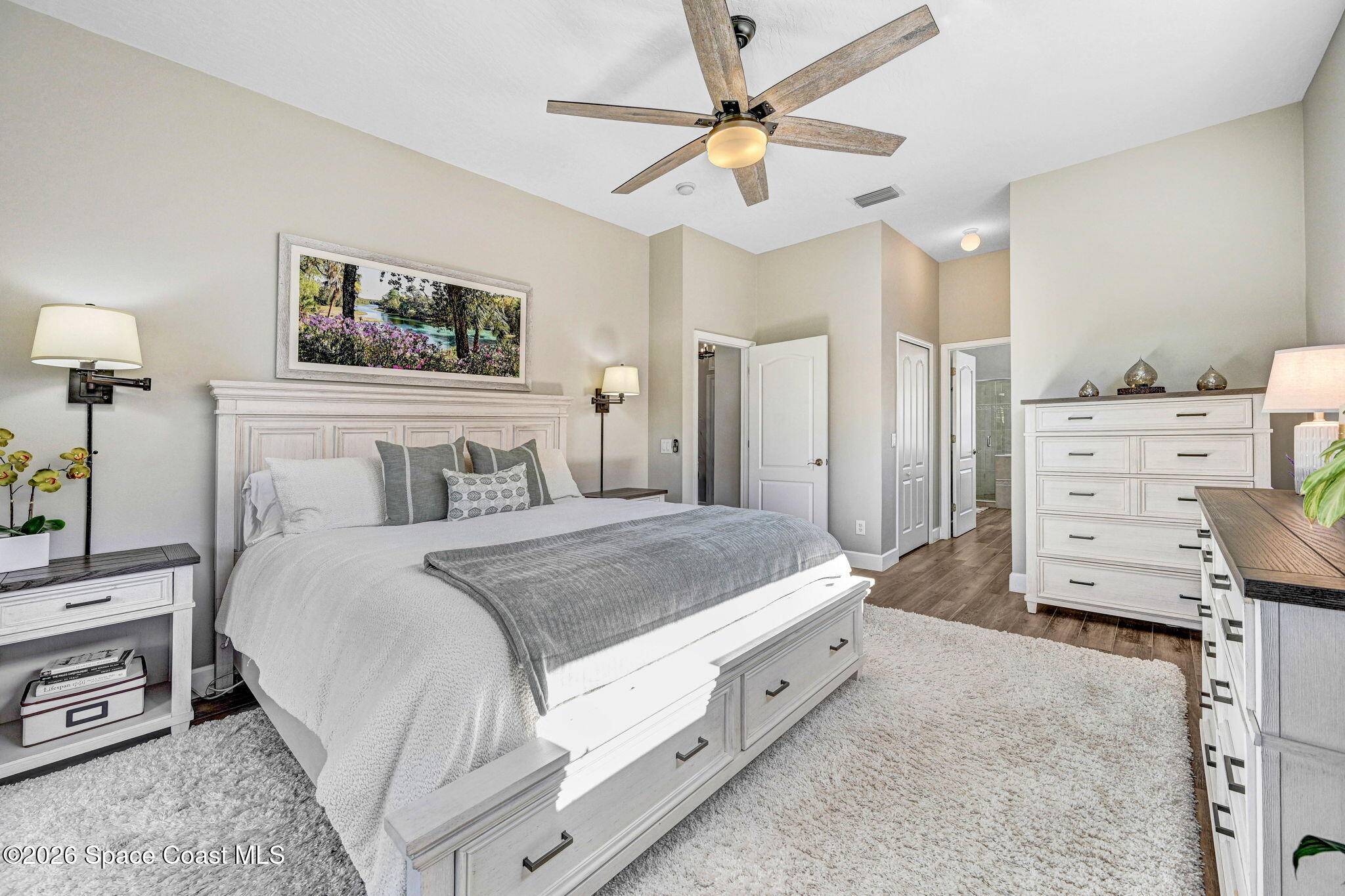 3330 Poseidon Way Indialantic, FL 32903 - Photo 22 of 47 a bedroom with a bed and a chandelier