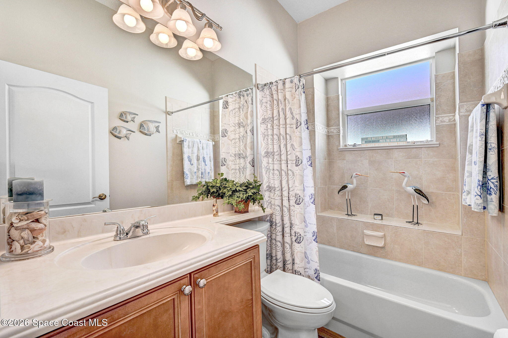 3330 Poseidon Way Indialantic, FL 32903 - Photo 26 of 47 a bathroom with a granite countertop sink a toilet and shower