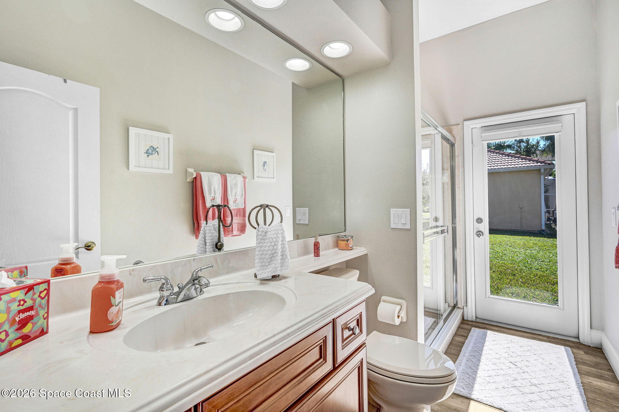3330 Poseidon Way Indialantic, FL 32903 - Photo 29 of 47 a bathroom with a sink a toilet and shower