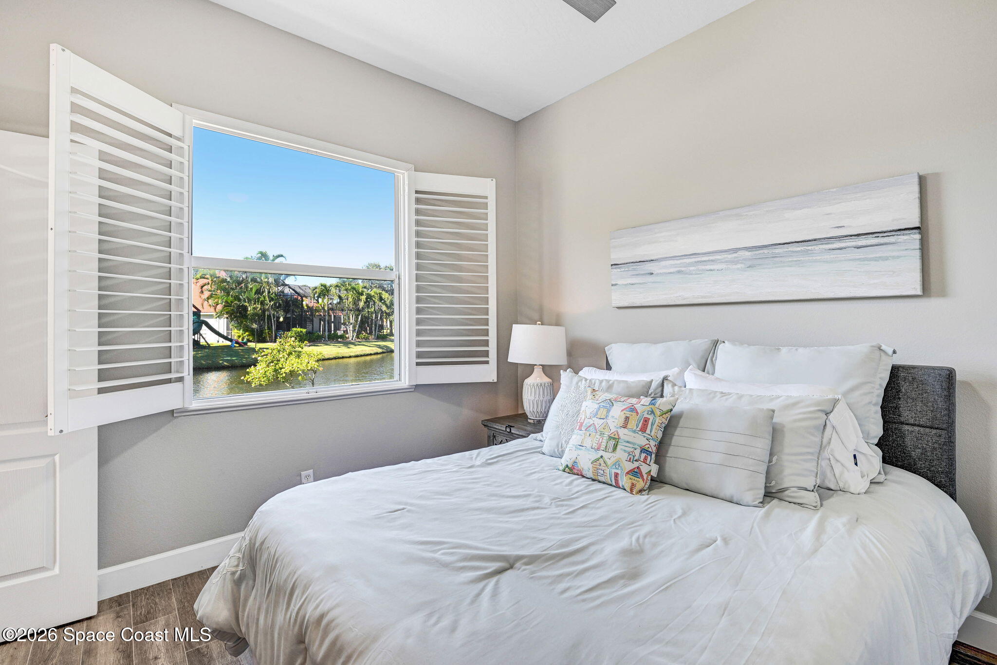 3330 Poseidon Way Indialantic, FL 32903 - Photo 30 of 47 a large bed sitting in a bedroom next to a window
