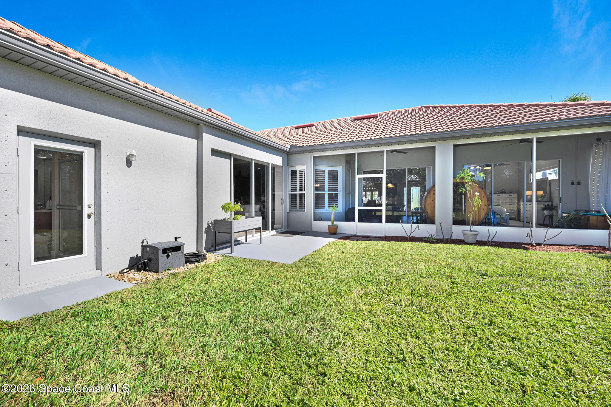 3330 Poseidon Way Indialantic, FL 32903 - Photo 35 of 47 a view of a house with sitting area and garden