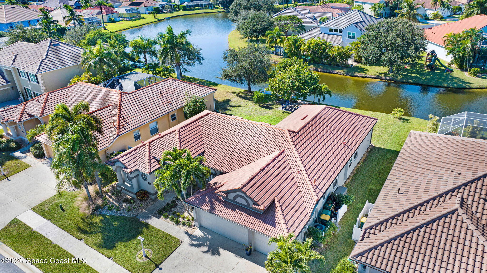 3330 Poseidon Way Indialantic, FL 32903 - Photo 4 of 47 an aerial view of house with yard and lake view