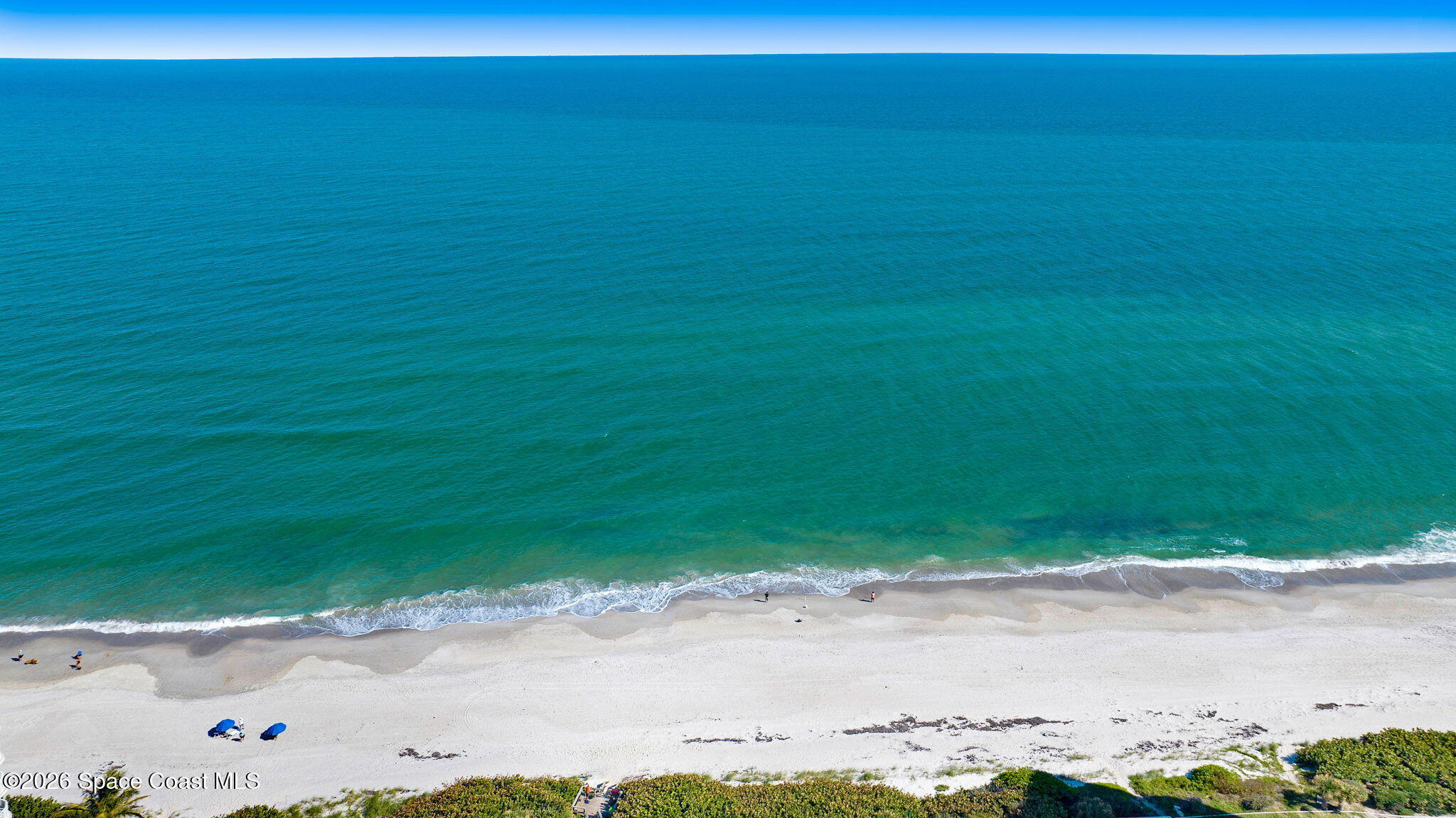 3330 Poseidon Way Indialantic, FL 32903 - Photo 47 of 47 a view of a beach with a big yard