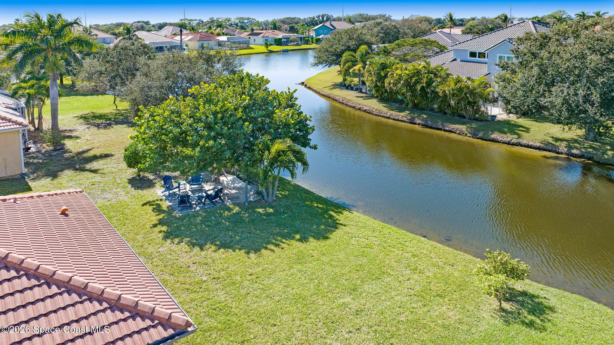 3330 Poseidon Way Indialantic, FL 32903 - Photo 5 of 47 an aerial view of a house with a yard and lake view