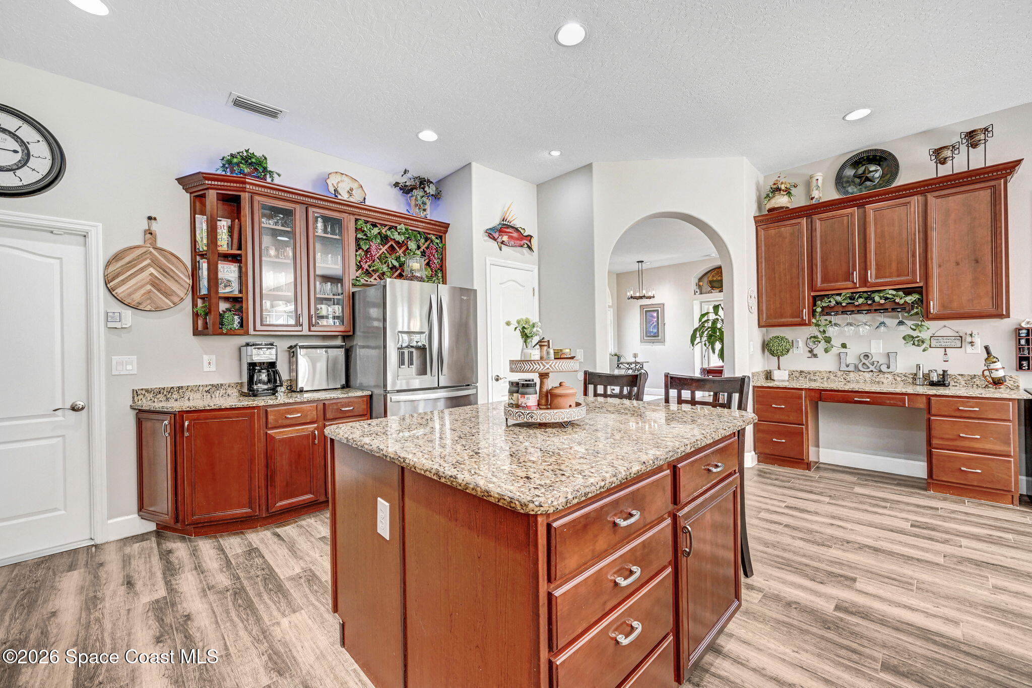 3330 Poseidon Way Indialantic, FL 32903 - Photo 9 of 47 a kitchen with stainless steel appliances granite countertop a kitchen island a stove and a sink