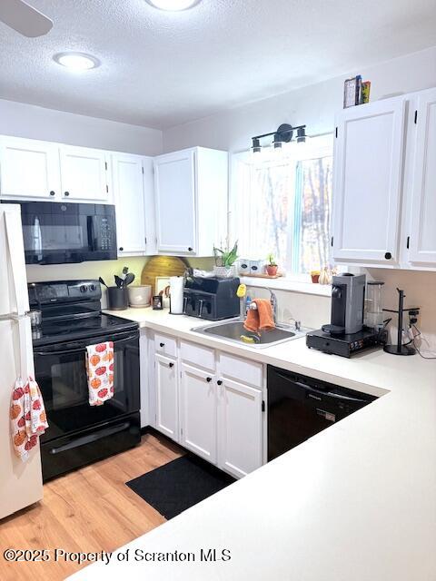 126 Dunchurch Drive Bushkill, PA 18324 - Photo 9 of 26 a kitchen with a sink stove and cabinets