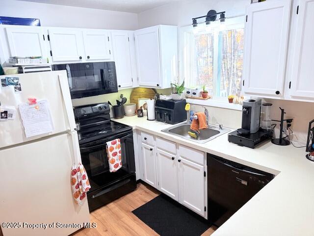 126 Dunchurch Drive Bushkill, PA 18324 - Photo 10 of 26 a kitchen with a sink a stove and white cabinets