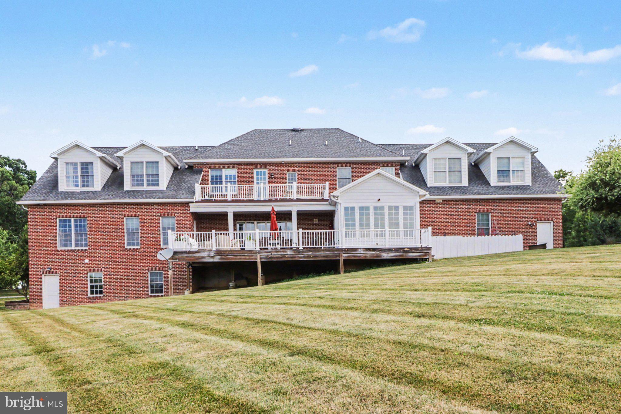 1080 Swatara Road Hershey, PA 17033 - Photo 49 of 59 a front view of a house with a garden and deck